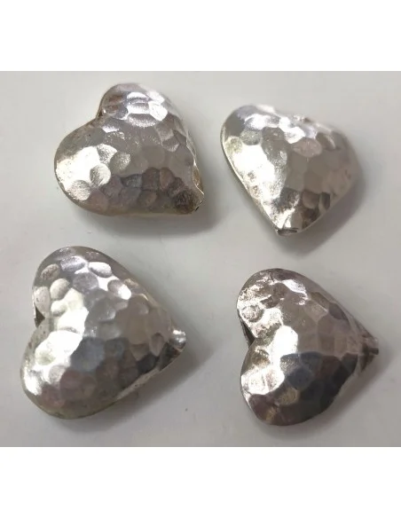 Coeur en argent percée.